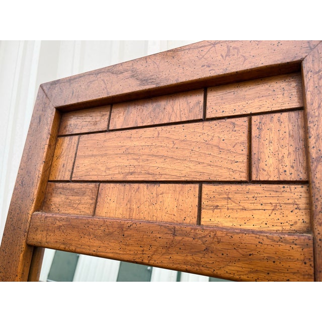 Two original walnut framed dressing mirrors in a Brutalist style made by Dixie in the mid 20th century. Each measures 20"...