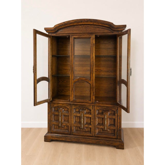 Crafted by American of Martinsville, this beautifully made vintage china cabinet showcases exceptional quality and...