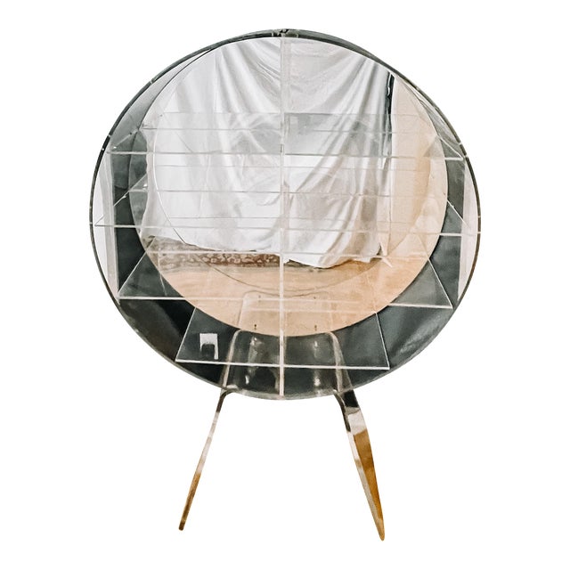 Vintage one of a kind post modern round lucite shelving unit. Large round and heavy Lucite with acrylic shelves. It has a...