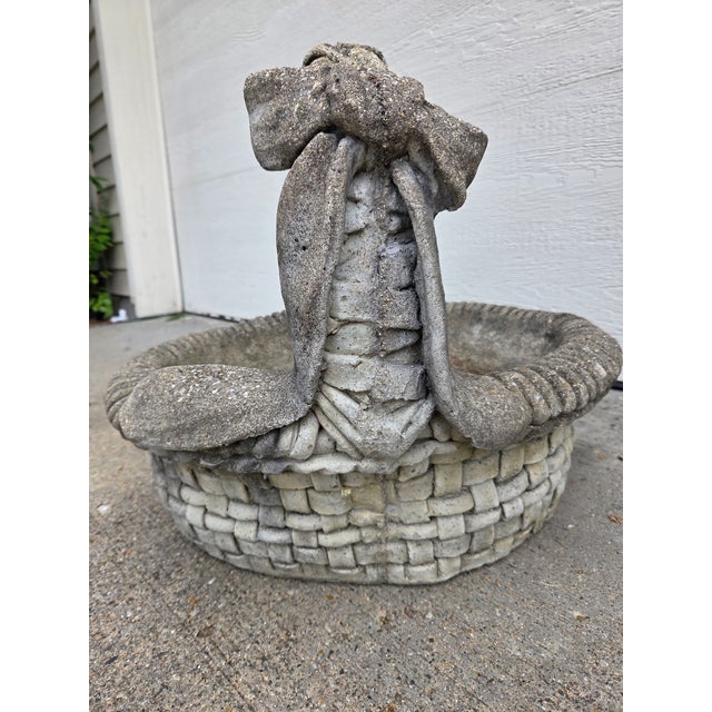 Large 22" Vintage Cement Basket Planter. Features a detailed bow with ribbon. Solid, heavy construction. Exceptional...