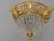 A richly decorative 1970s Baroque Revival ceiling lamp, crafted in solid bronze with crystal accents and finished in a...
