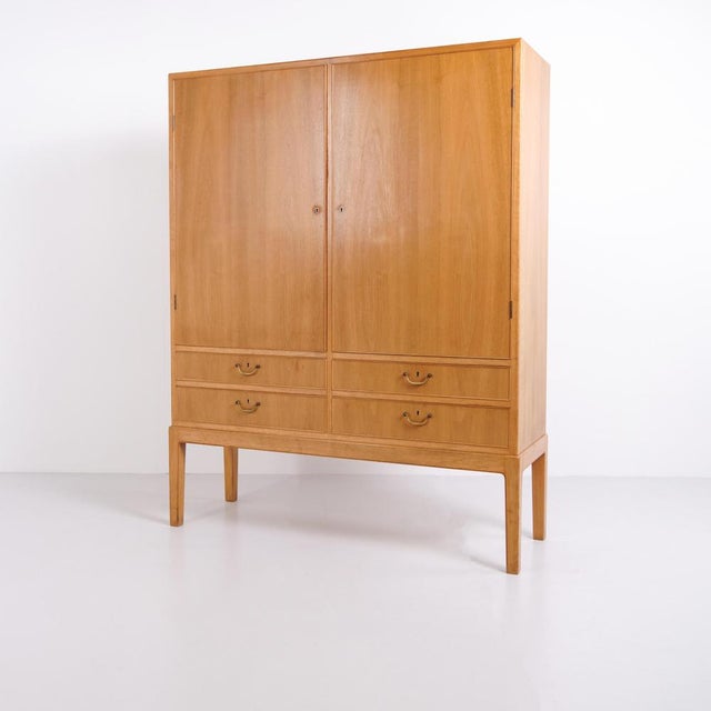 Cabinet for tableware designed by ole wanscher and produced by a.j. Iversen in the 1940s. Crafted in light walnut with...