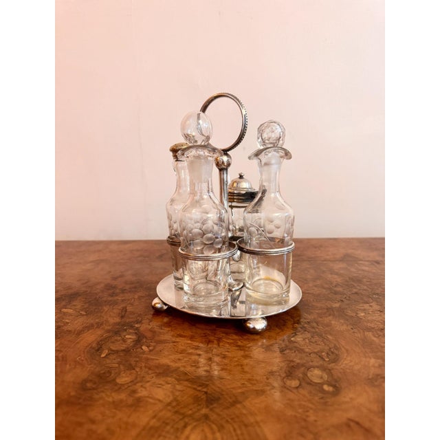 Lovely quality antique Edwardian silver plate cruet set, having a quality antique Edwardian cruet set, with a circular...