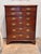 A tall 19th century chest in well figured mahogany, fitted with two short drawers over five long graduated drawers, each...