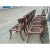 Klismos solid walnut dining chairs. The chairs are made of solid walnut with a satin finish and leather cording. The...