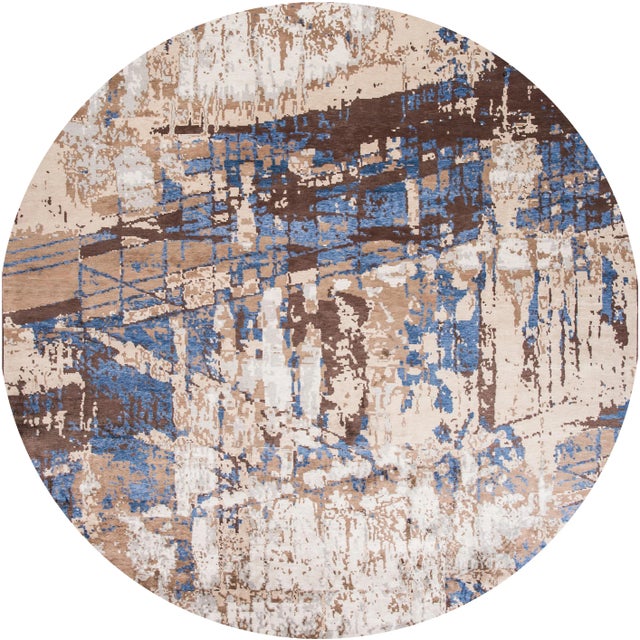 A beautiful large modern hand-knotted wool rug with an ivory field, beige, blue and brown accents in all over abstract...