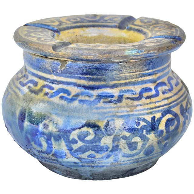 Antique handcrafted and glazed Moroccan ceramic ashtray featuring an elaborate hand-painted Moorish design in blue and...
