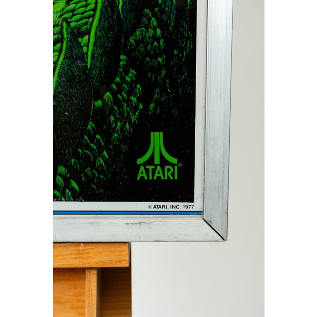This piece is the original top light panel, also known as a translite or backglass, from the "Middle Earth" pinball...