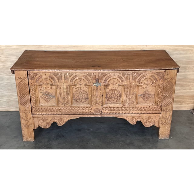 A provincial wooden trunk from 1800s North Europe The charming case is decorated with carved spiral patterns intertwined...
