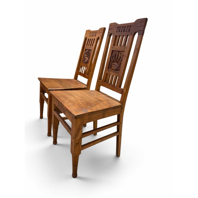 English Pair of Vintage Dutch Colonial Hand-Carved Teak Crown Motif Dining Chairs For Sale - Image 3 of 7