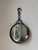 Vintage large and thick metal mirror with its hanging chain, dating from the 1950s. Inspired by Brutalist design, its...