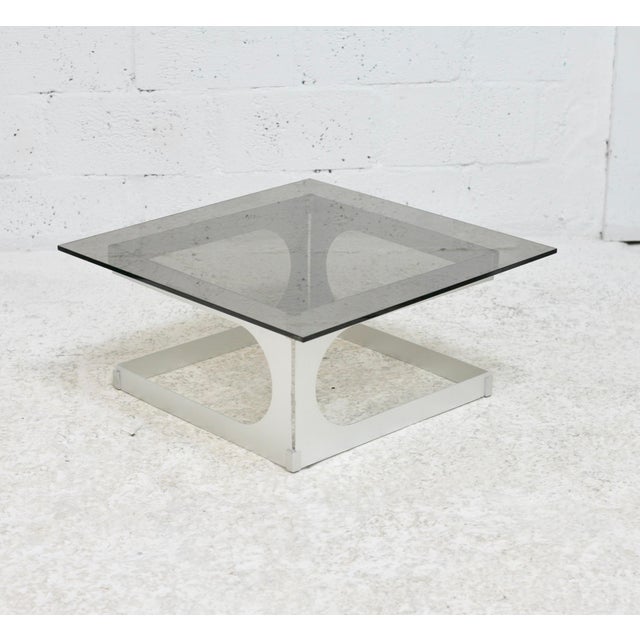 Coffee table by Pierre Vandel, France, 1970s Visible logo Metal frame supported by a smoked glass slab. Rare model Small,...