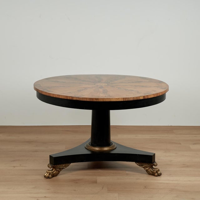 Impressive antique Italian center table having a top crafted in a kaleidoscopic burled walnut design with a floral center...