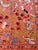 Hand-embroidered Suzani panel from Uzbekistan — white cranes and birds among dotted rosettes and green vines on a coral...