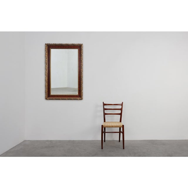 This French classical mirror from around 1900 combines refined architectural lines with beautifully executed gilded...