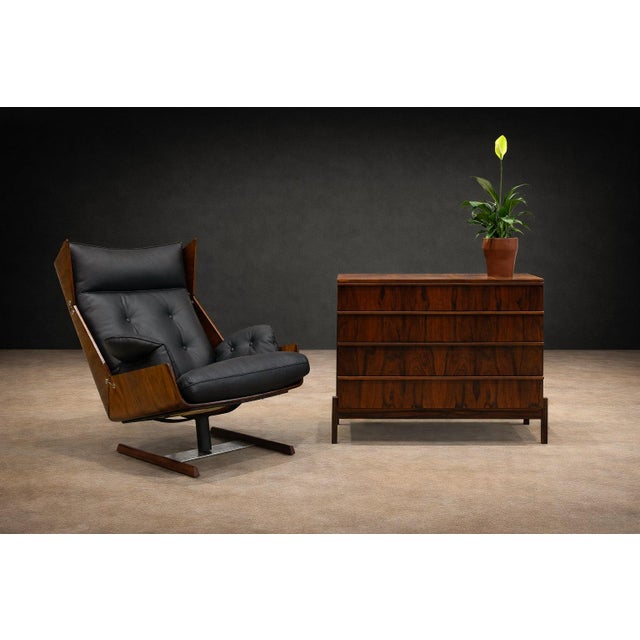This armchair and ottoman set by JD Móveis dates to the 1960s, a period defined by experimentation and optimism within...