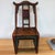 Charming antique Chinese child’s chair featuring a beautifully shaped yoke-style back in a wonderfully aged wood finish...