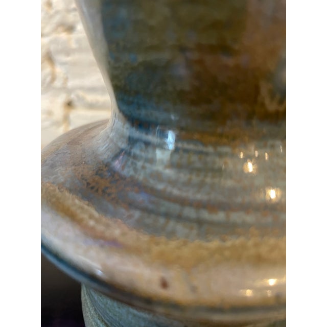 Hand-thrown ceramic vase. Delicate greens, blues and gold with almost bubble-like details. Perfect as a vase, brush holder...