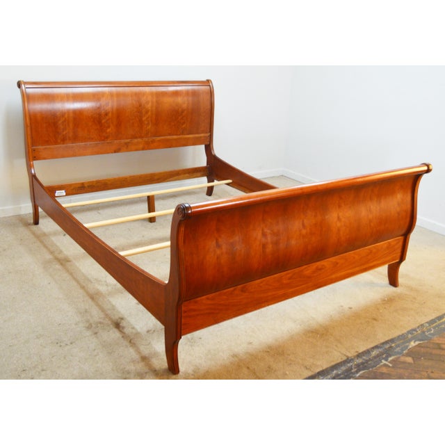 Queen Bed by Ethan Allen. Store item #530. It features solid wood construction and comes with slats (legs for slats are...