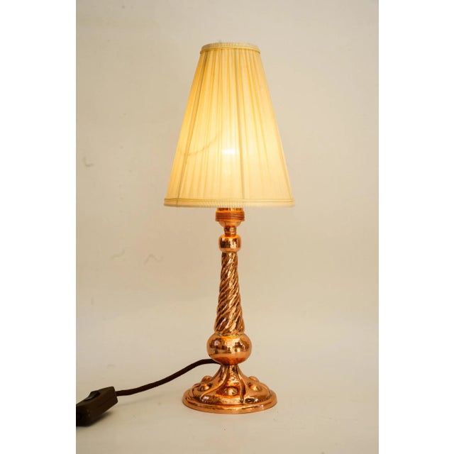 Art Deco Copper Table lamp with fabric shade vienna around 1920s. Polished and stove enameled. The fabric shade is...