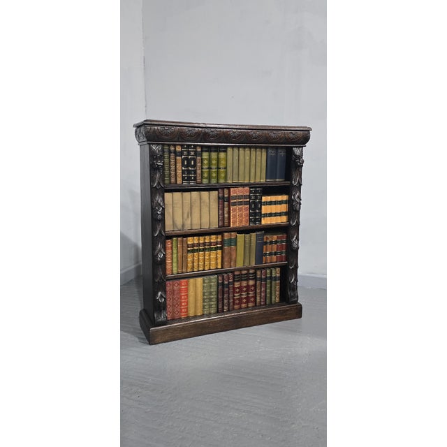 A very nice solid oak, open adjustable library bookcase with carved front, three adjustable shelves, excellent colour and...