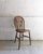 This set of four antique dining chairs, crafted from solid oak, dates back to the early 20th century. These elegant...