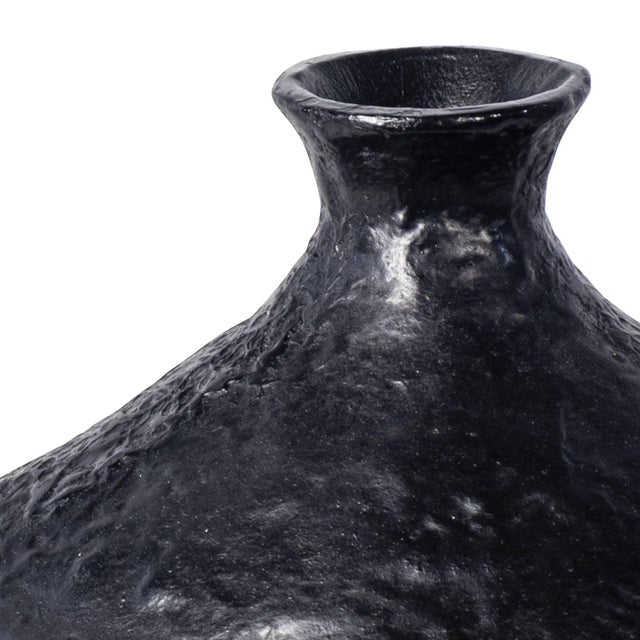 The blackened plaster finish of our Poe Vase is mottled with texture that is crafted to have an artisan, handmade feel....