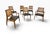 A stylish set of six Mid-Century Modern walnut dining chairs, dating to the 1960s, featuring beautifully shaped frames and...