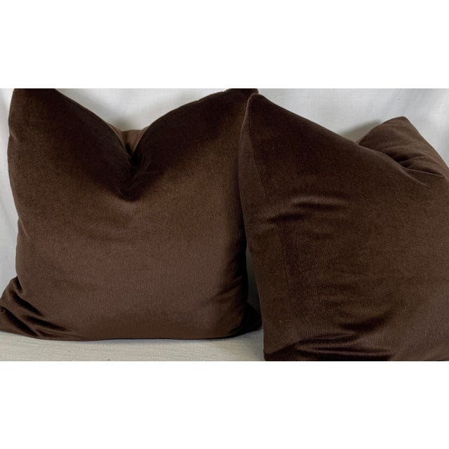 Custom pair of 22" pillows covered in Holly Hunt "Silk and Sexy" silk mohair in color cavern, a dark brown. These pillows...