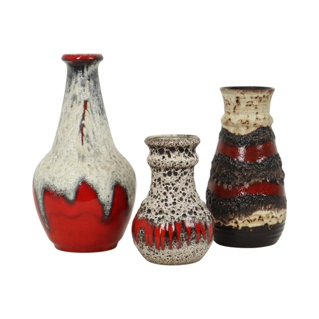 A lovely set of three rare "Fat Lava" vases—West German pottery dating from approximately the 1960s or 1970s—each marked...