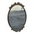 Original 1930 Italian solid brass oval wall mirror featuring a finely detailed decorative frame. The brass has its...