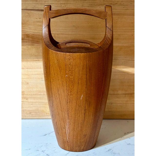 An iconic Mid-Century Modern masterpiece, this vintage Dansk "Congo" staved teak ice bucket designed by the legendary Jens...