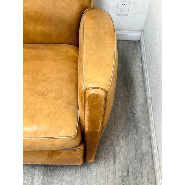 Beautiful vintage soft leather sofa filled with feather cushions in good vintage condition