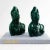 Elegant pair of ceramic bust sculptures portraying mythical goddesses glazed in a rich, deep emerald green finish. These...