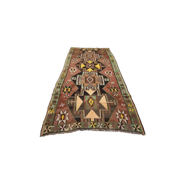 Handwoven vintage kilim rug from Kars region of Turkey. Approximately 50-60 years old. In very good condition.