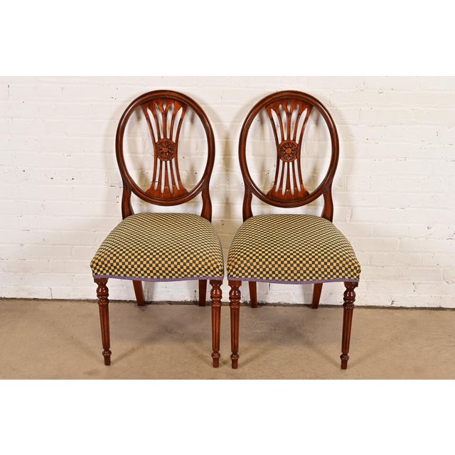 A gorgeous pair of French Regency Louis XVI style side chairs or dining chairs By Bevan Funnell Ltd. USA, Circa Late 20th...