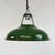 A classic industrial pendant by Coolicon, with a wide domed shade in deep green vitreous enamel and a bright white enamel...