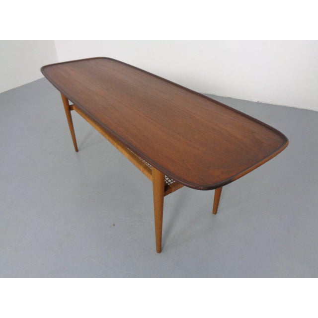 Teak table with rattan shelf and oak legs by Børge Mogensen from the 1950s. I have official proof of authenticity such as...