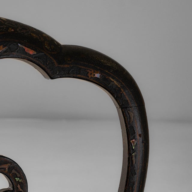 This 1860s French Louis XV wooden chair presents an elegant silhouette enriched with graceful curves and delicate...