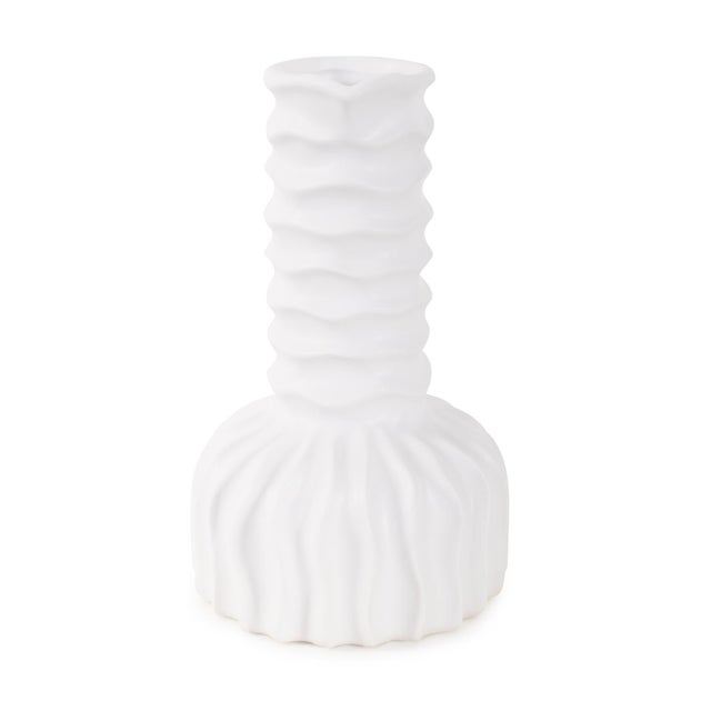 The Herring Vase is a striking abstract matte white vase that is crafted with intricate forms and textures. With its...