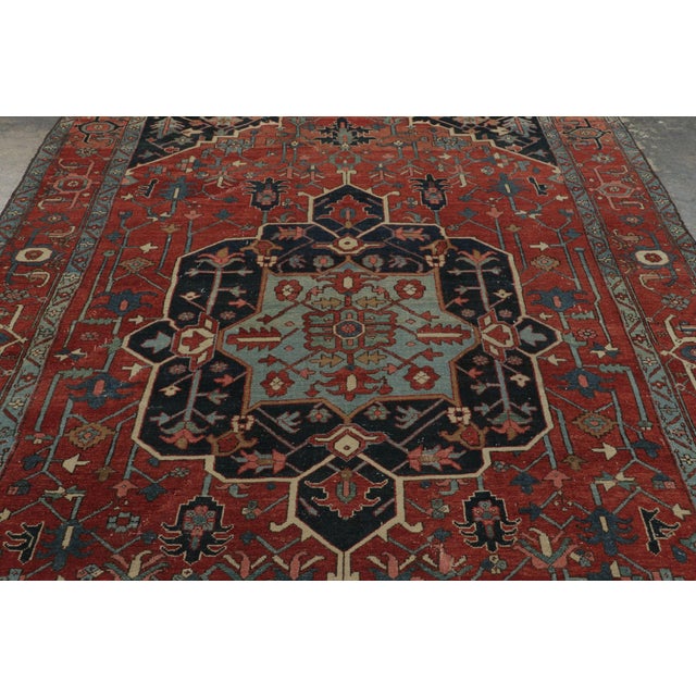 This approximate 7x11 antique Persian rug is a classic Karaje piece, hand-knotted in wool circa 1900-1919. Belonging to a...