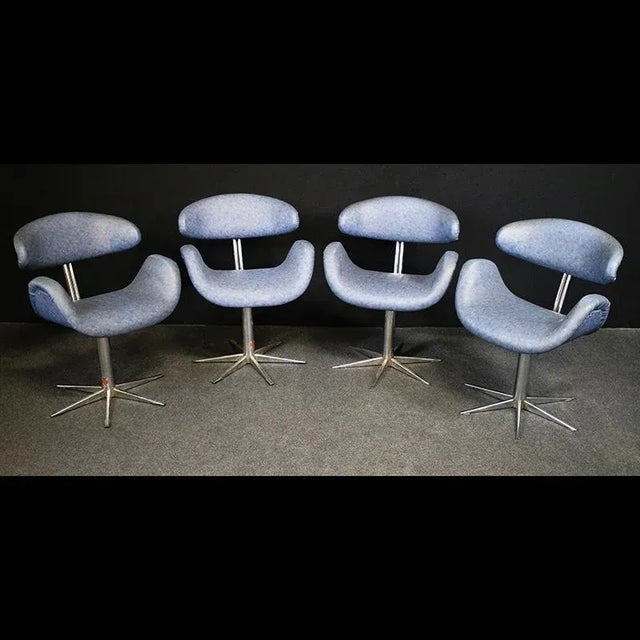 Group of 4 original vintage hairdressing chairs from the 1960s, in chromed steel and light blue eco-leather. Dimensions:...
