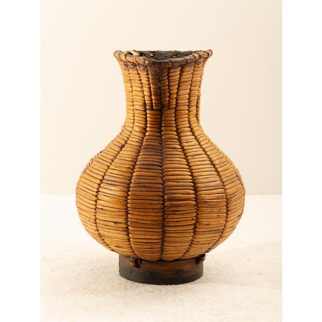 Spanish wicker jug, mid-century. A typical wine jug traditionally used in Galicia, Spain. The entire body rests on a...