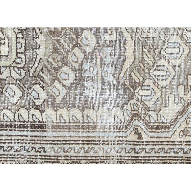 This semi-antique Persian Melayer rug, measuring 4'3" x 6'6", is handwoven in Iran’s Hamadan region and has been carefully...