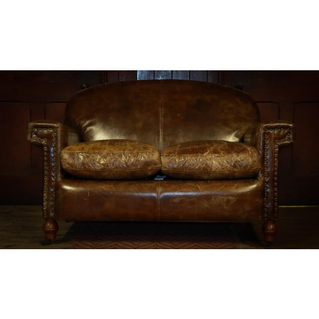 Up for grabs here is an impressive timothy oulton halo sofa in antique whisky leather. Extremely rare, chances are you...