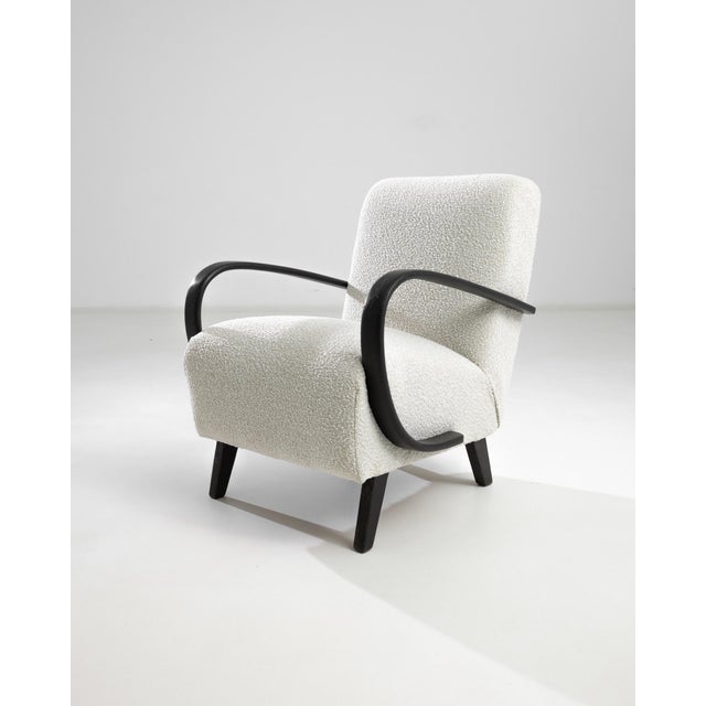 Introducing the 1950s Czech Wooden Armchair by J. Halabala, a timeless piece that combines vintage charm with modern...