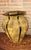 Hand-hammered brass vase in a traditional Indian style. It stands out for its stylized hexagonal shape and pronounced...