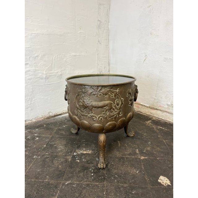 Great bespoke side table. Regency style brass cachepot base wonderfully detailed with Lions, laurel, fleur-de-lis, birds,...