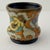 A charming miniature example of early 20th-century Dutch Gouda pottery, this antique vase was produced by Plateelbakkerij...