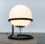 Elegant Space Age standing or table lamp An imposing, yet simple design. A large crystal ball is held in an elegantly...